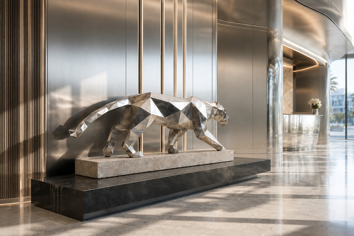 Imperial Stride Panther — 62 cm faceted stainless steel panther sculpture mid-stride on a travertine base, close view in the room