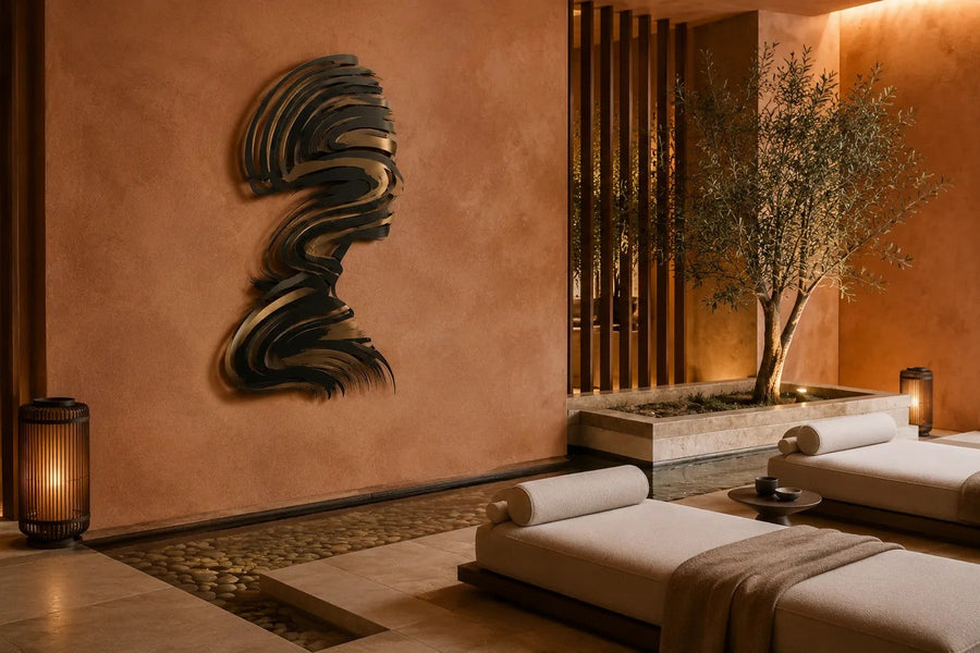 Jamuh 180 — 180 cm stainless steel wall sculpture of a human head in profile made of swirling black and bronze strokes, placed in a furnished room