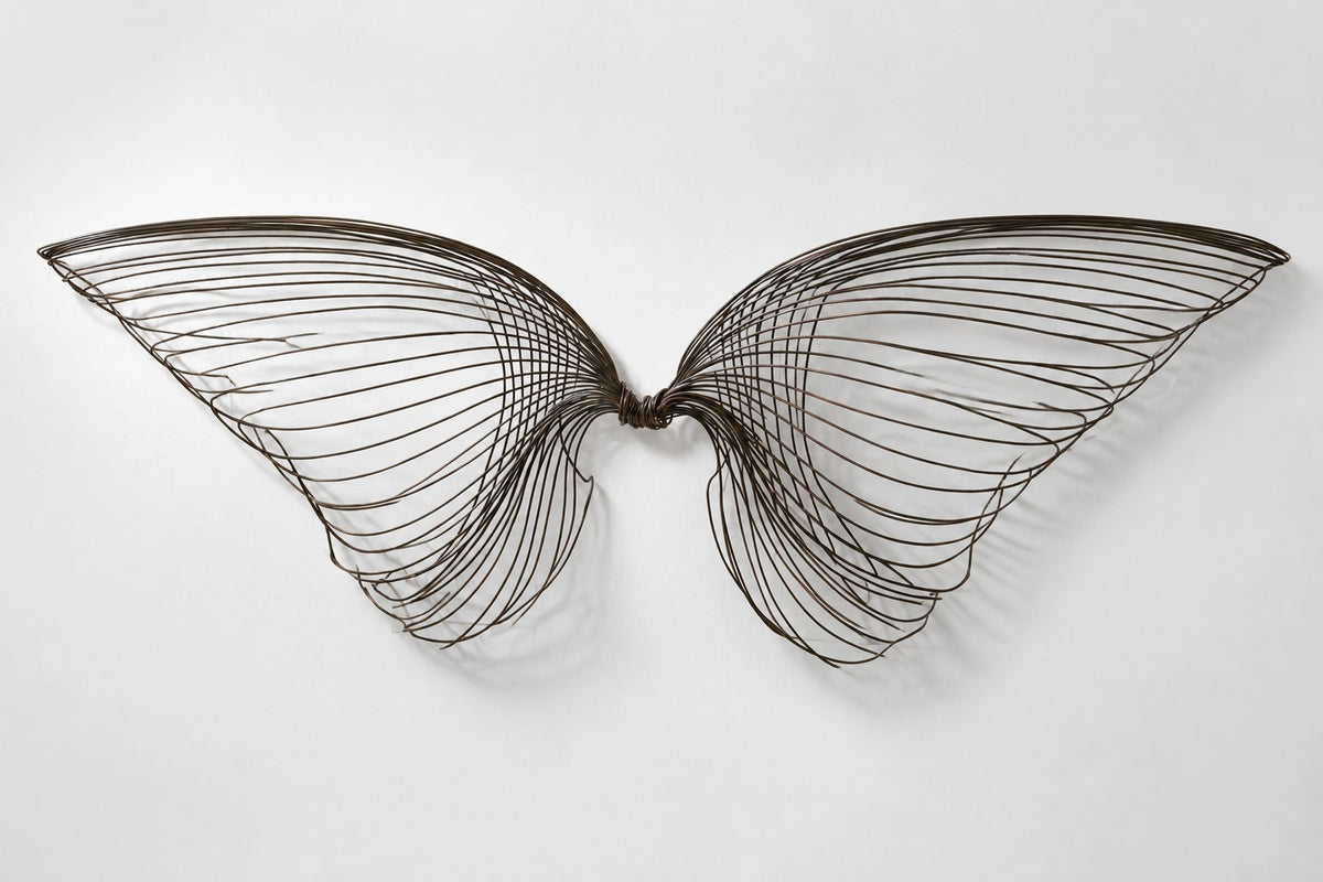 Janah — dark bronze wire wall sculpture of two outstretched wings, studio front view