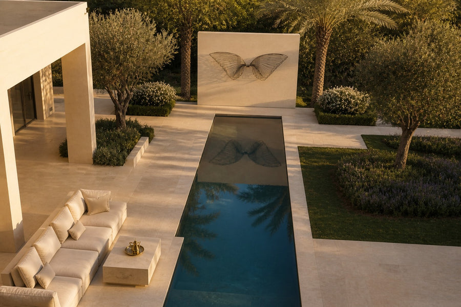 Janah — dark bronze wire wall sculpture of two outstretched wings, seen from above in the room