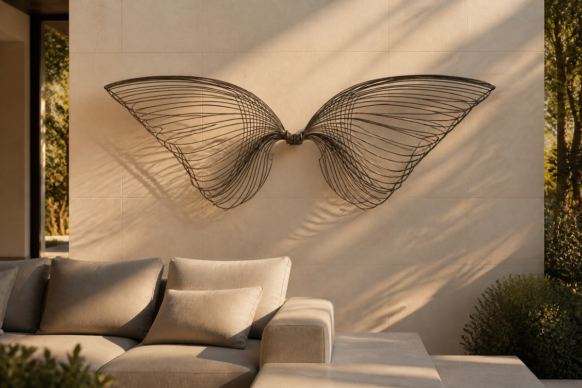 Janah — dark bronze wire wall sculpture of two outstretched wings, close view on the wall