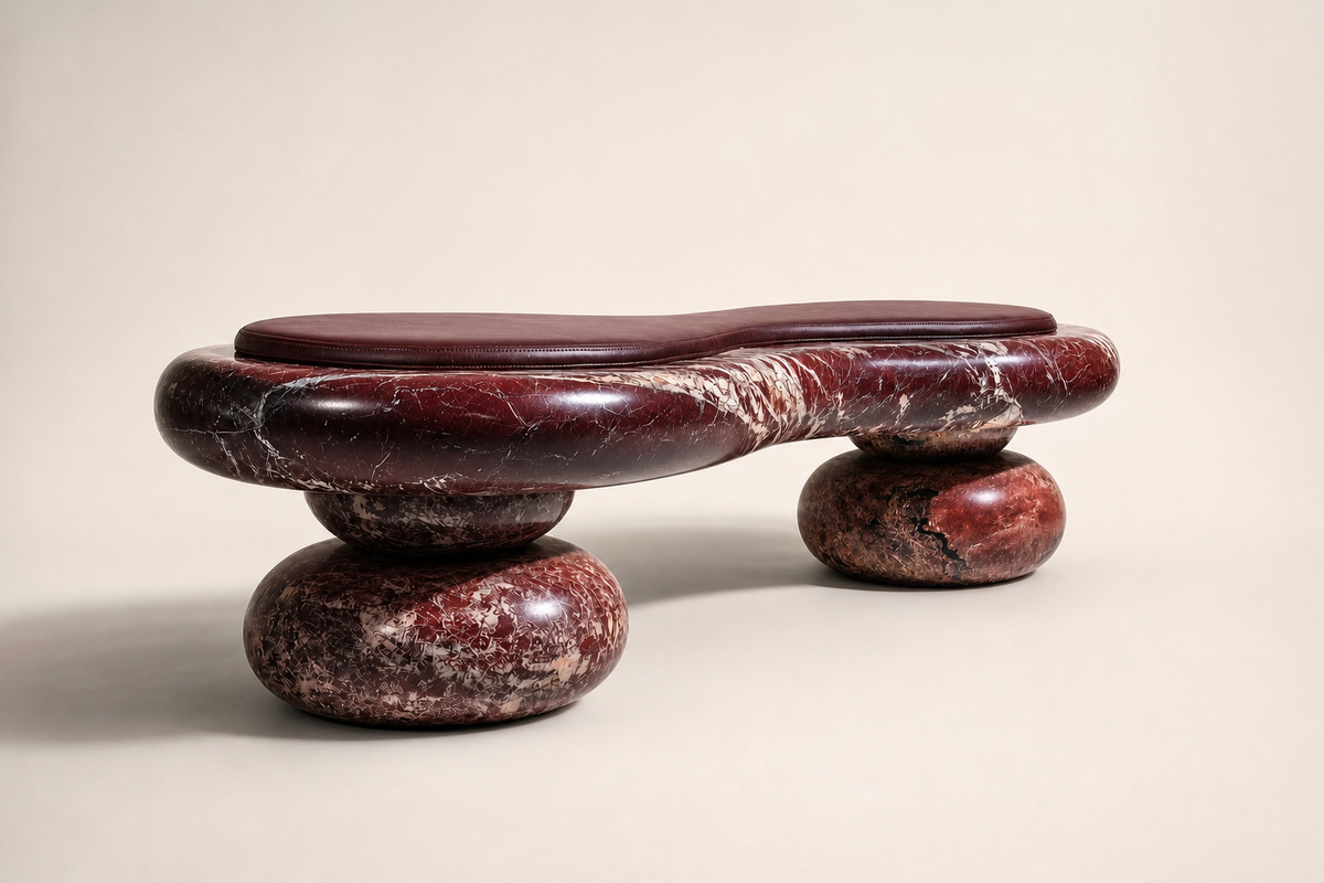 Kaze stone sculptural bench, three-quarter studio view showing its profile