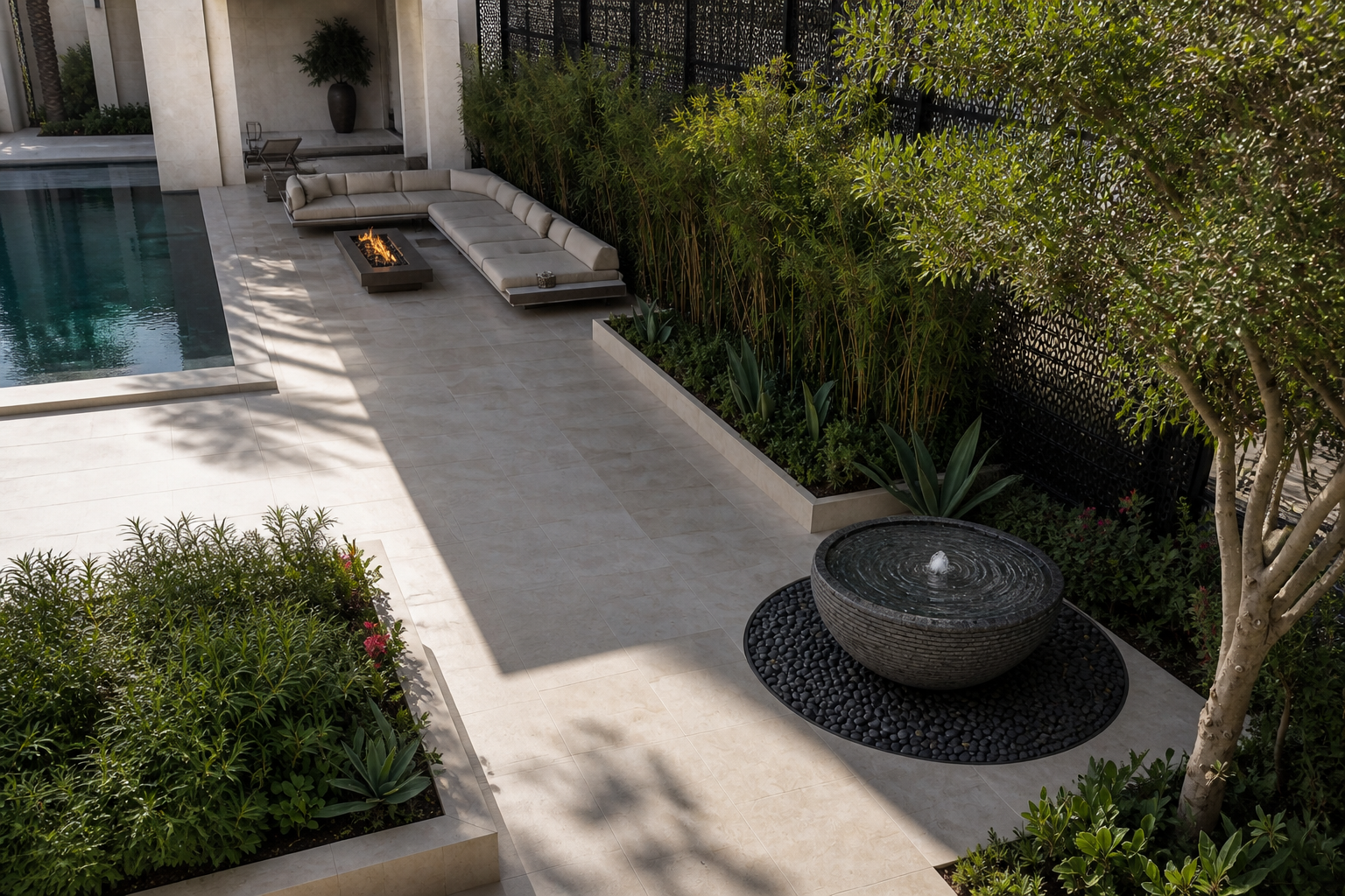 Lagoa charcoal stone bowl fountain by 1-OPH seen from above in pebbles