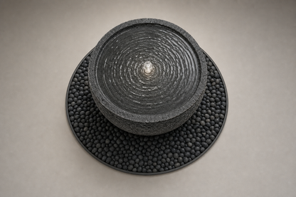 Lagoa charcoal stone bowl fountain by 1-OPH, overhead view of the still surface