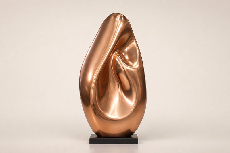 Lahab — 60 cm mirror-polished copper ovoid sculpture with a deep flame-like fold, studio view of the whole piece