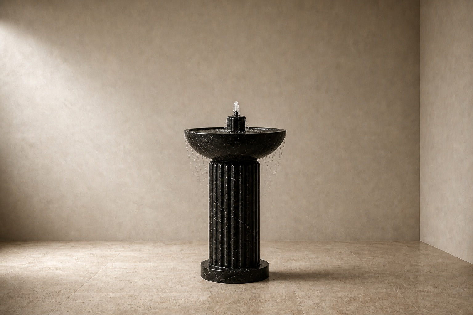 Dark marble pedestal fountain Layla Ø65, deep black with white veining, on a pale stone floor.