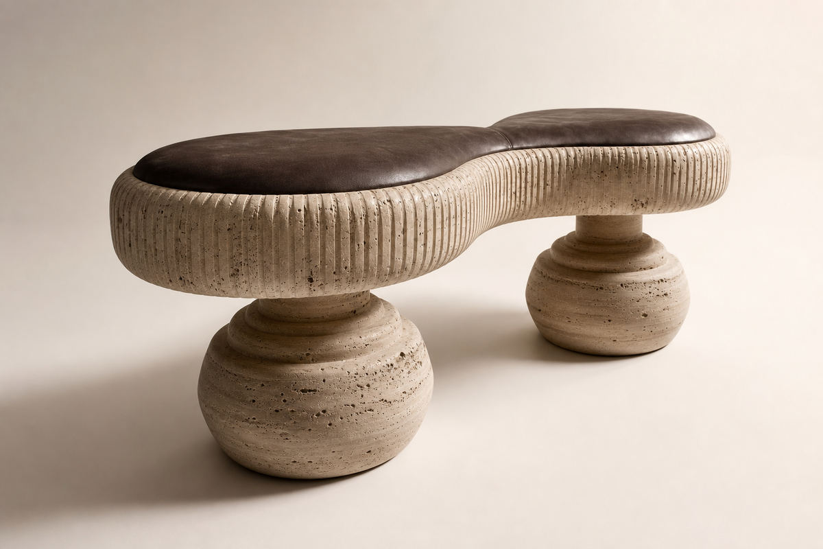 Lento travertine sculptural bench, three-quarter studio view showing its profile