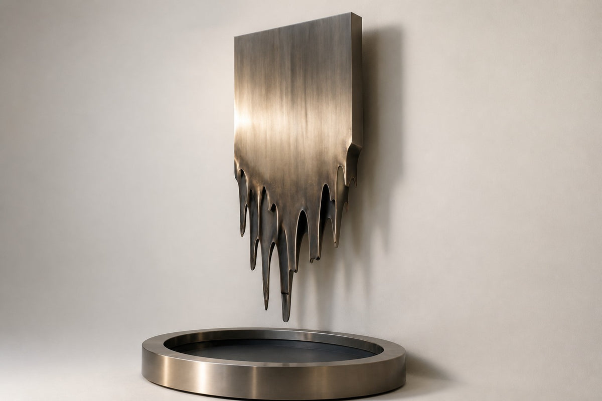 Lumen — melting stainless panel wall fountain, studio side angle showing its depth