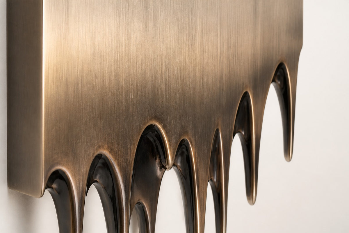 Lumen — melting stainless panel wall fountain, close detail of the surface and edge