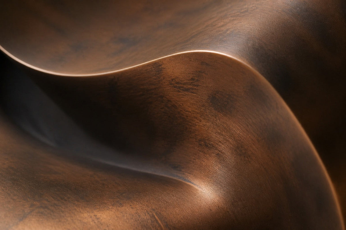 Mahara — 140 × 110 cm dark bronze wall sculpture of a layered shell with a glowing amber core, close studio detail of the surface and material