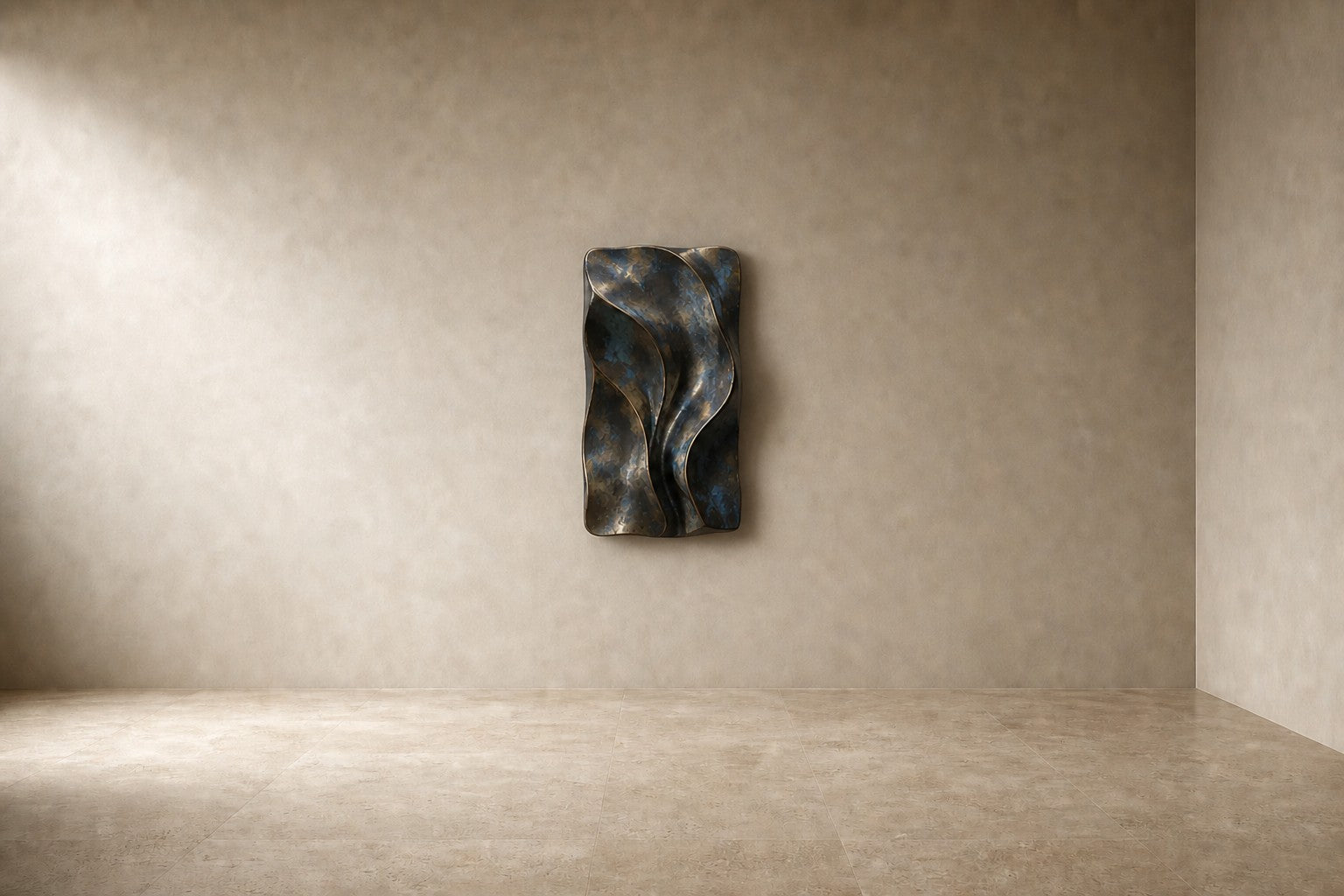 Antique bronze bronze wall sculpture Cuna, nested open ovals cradling a polished core, on a plaster wall.