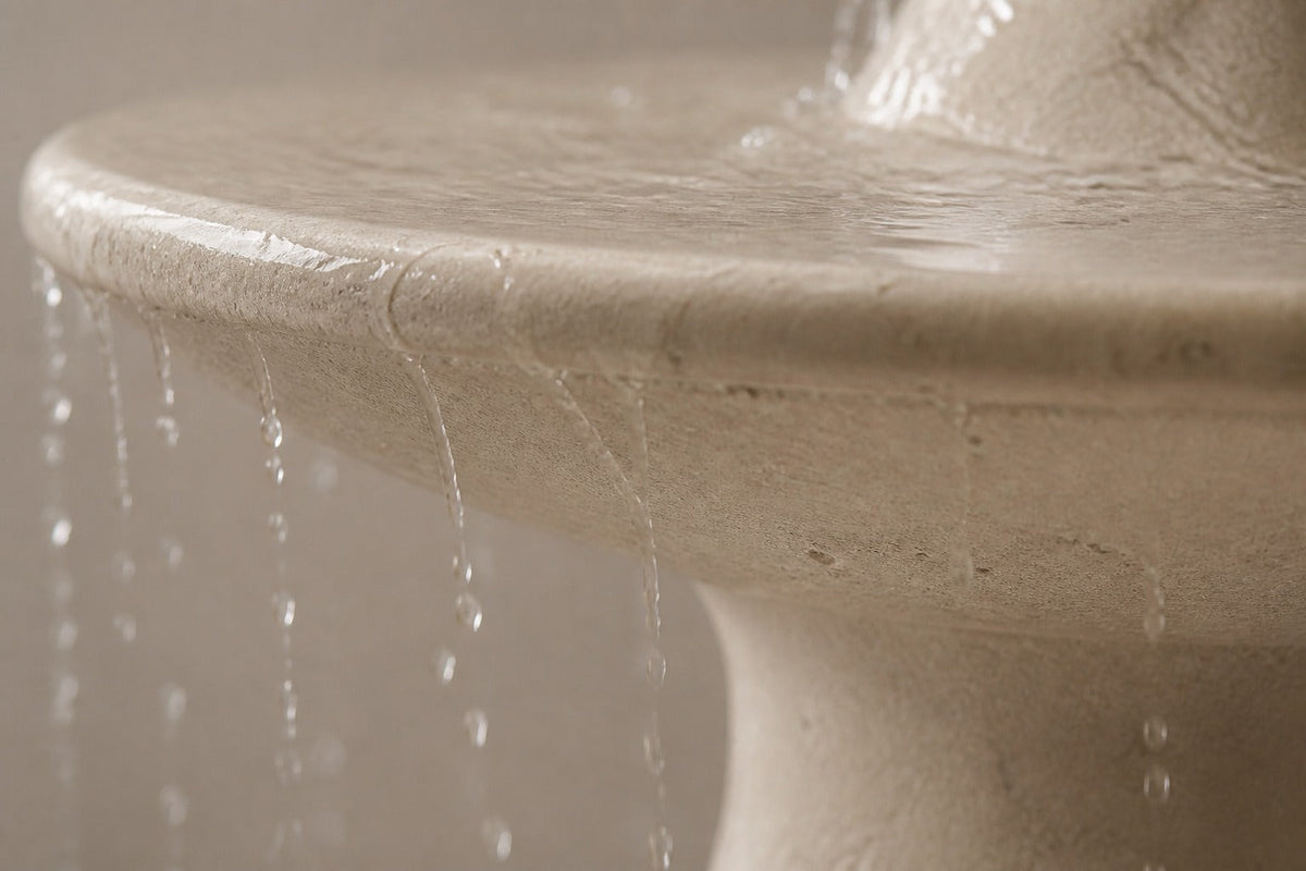 Marena Ø65 limestone pedestal fountain, close detail of the surface and the basin rim