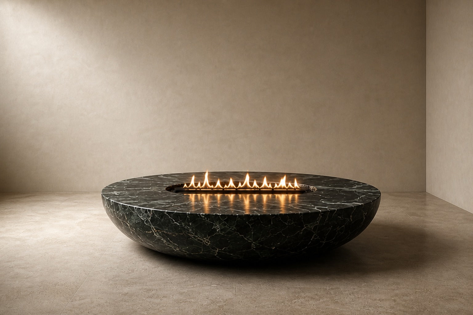 Dark green-black marble fire bowl Mayura Ø180, dark green-black with white veining, on a pale stone floor.