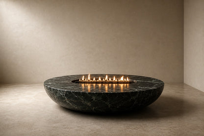 Dark green-black marble fire bowl Mayura Ø180, dark green-black with white veining, on a pale stone floor.