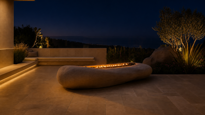 Cenera beige stone fireplace by 1-OPH lit at night