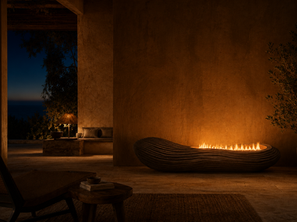 Scorena black marble fireplace by 1-OPH lit at night