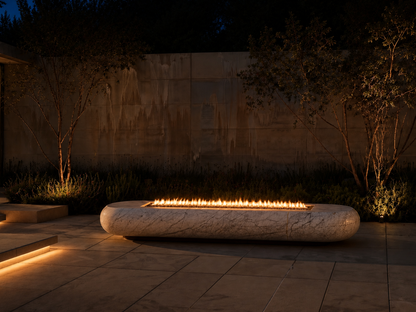 Lattea white marble fireplace by 1-OPH lit at night