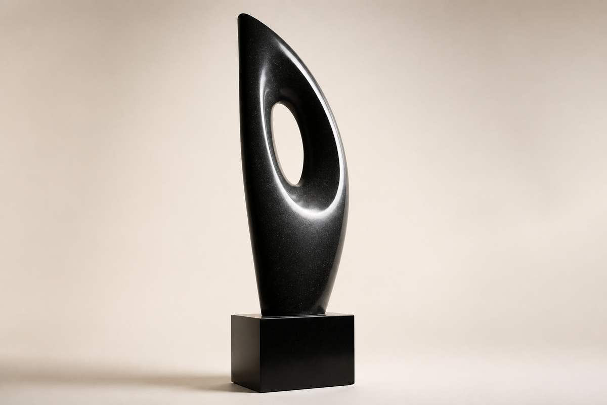 MONOLITH VOID I stone sculpture, three-quarter studio view showing its profile