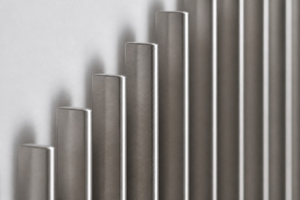 Nagare — stainless steel rod skyline wall sculpture, close detail of the surface and edge