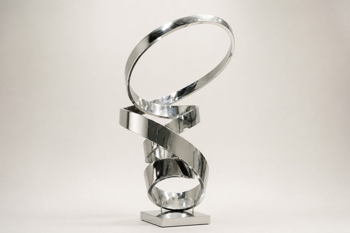 Nashira — 200 cm mirror-polished steel ribbon loops rising into an open ring, studio view of the whole piece