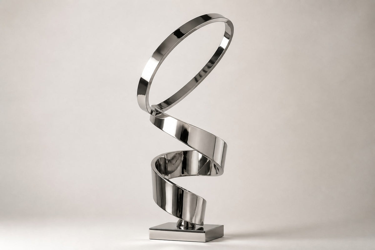 Nashira — 200 cm mirror-polished steel ribbon loops rising into an open ring, three-quarter studio view showing its profile