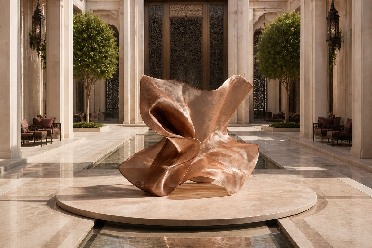 Rose copper woven wire sculpture Nihal, folded planes furling in on themselves around a glimpsed interior.