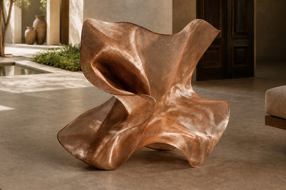Rose copper woven wire sculpture Nihal, folded planes furling in on themselves around a glimpsed interior.