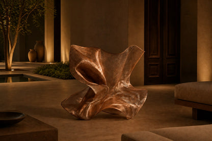Rose copper woven wire sculpture Nihal, folded planes furling in on themselves around a glimpsed interior.