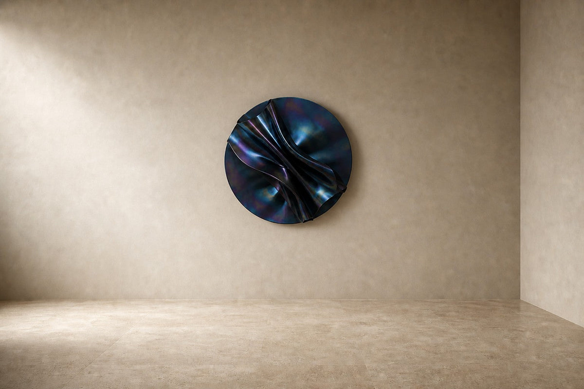 Nilam Ø110 — 110 cm midnight blue folded stainless steel wall disc, studio view of the whole piece
