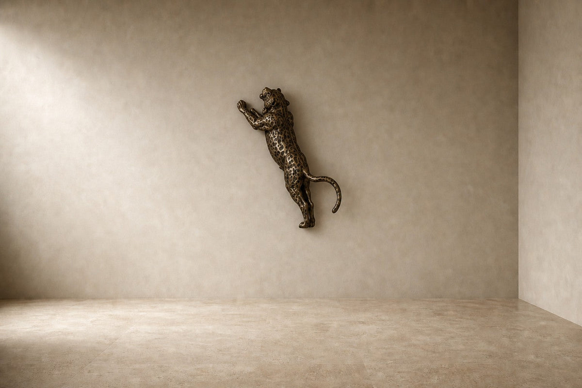 Nimr 40 — 40 cm dark bronze wall sculpture of a spotted leopard climbing the wall, studio view of the whole piece
