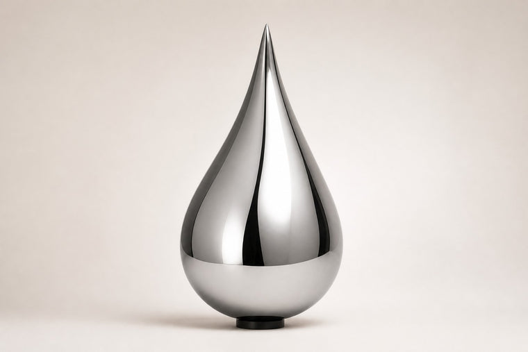 Nuqta — 170 cm mirror-polished steel teardrop sculpture on a small dark base, studio view of the whole piece