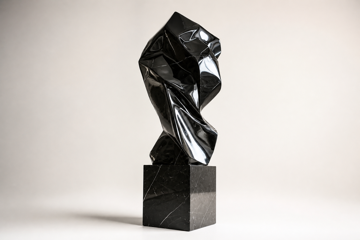 OBSIDIAN FOLD stainless steel sculpture, three-quarter studio view showing its profile