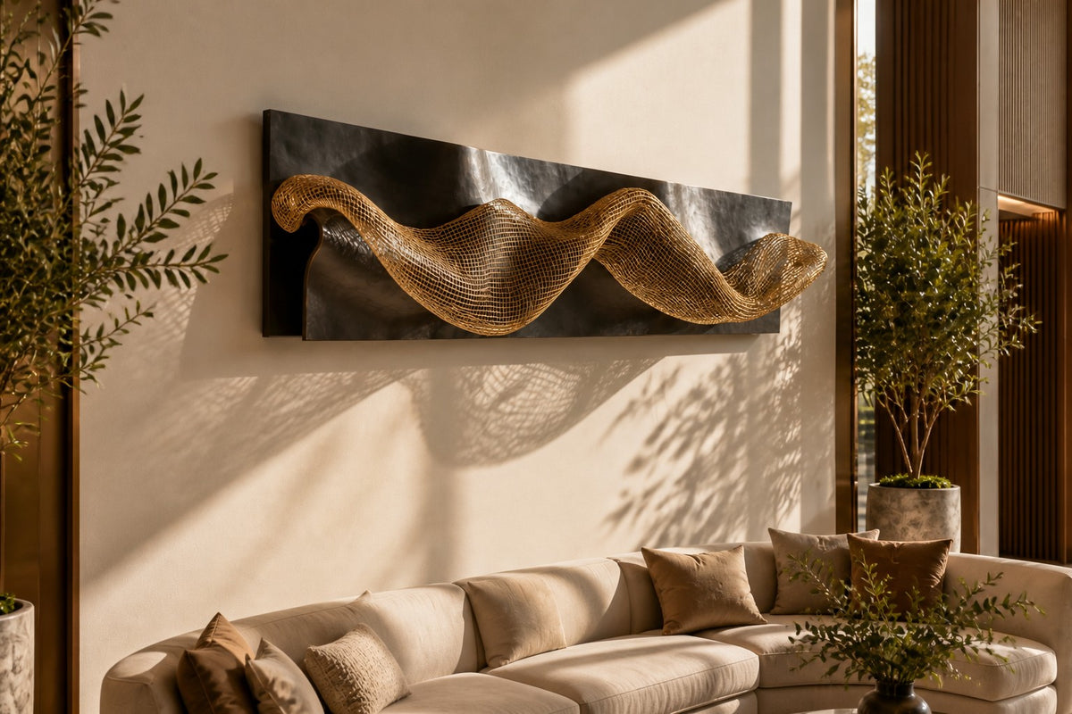 Oleaje — dark bronze wave plate crossed by a band of brass mesh, close view on the wall