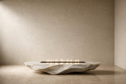 Calacatta marble fire table Onara 220, white with gold and grey veining, on a pale stone floor.