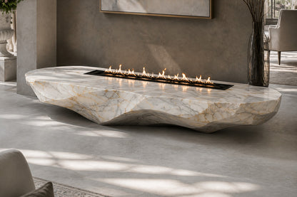 Calacatta marble fire table Onara 220, white with gold and grey veining, on a pale stone floor.