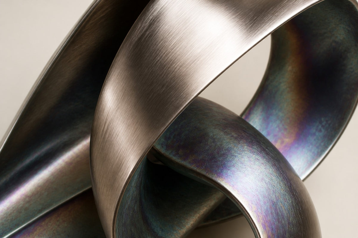 Orin — iridescent ribbon wall fountain, close detail of the surface and edge