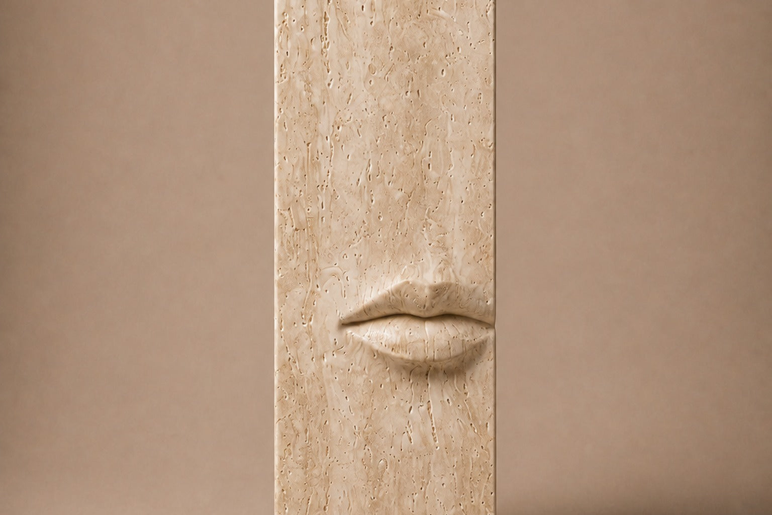 Tall cream travertine pedestal with a mouth carved in relief on one face.