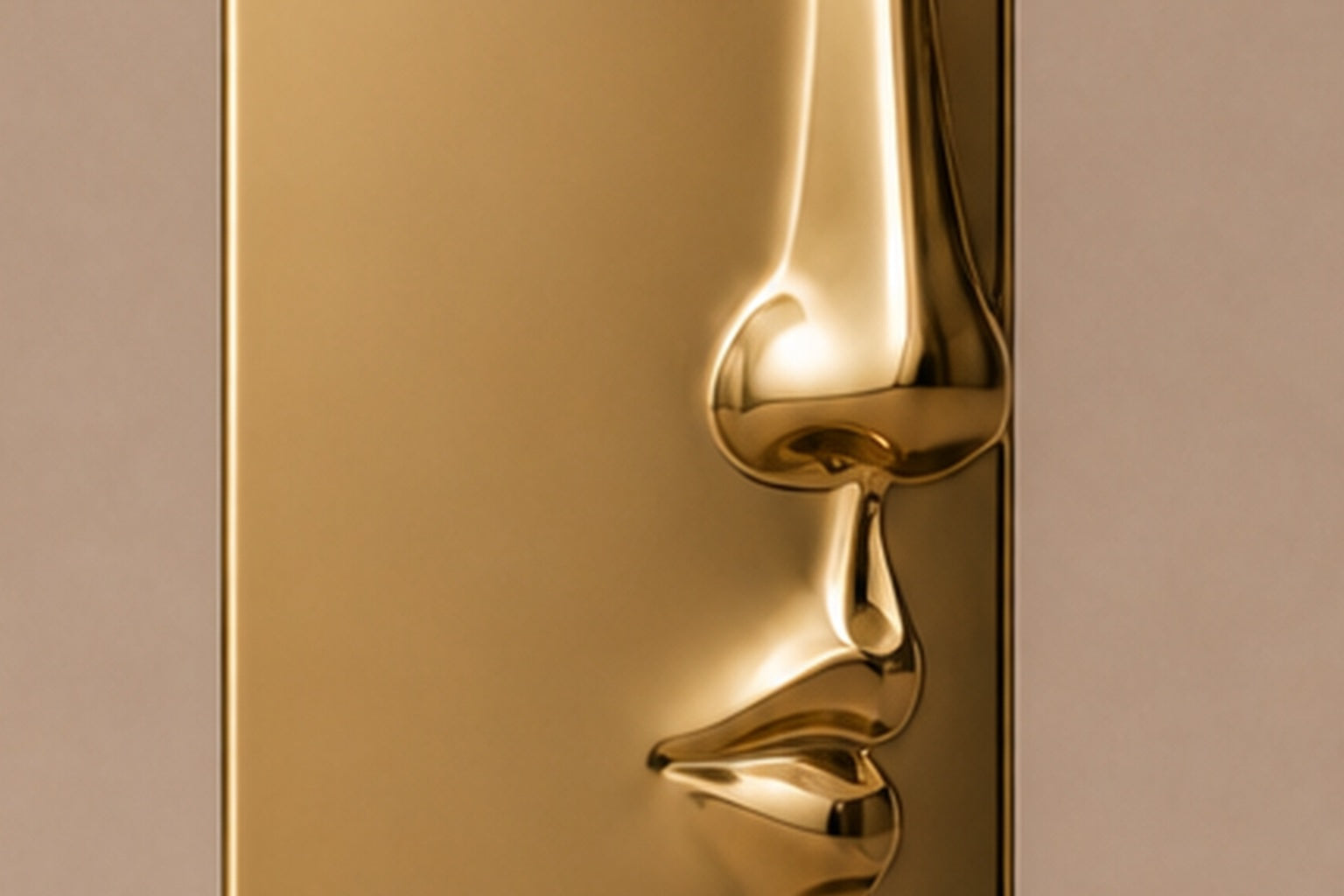 Tall gold PVD pedestal with a closed eye, nose and mouth formed seamlessly out of one face.