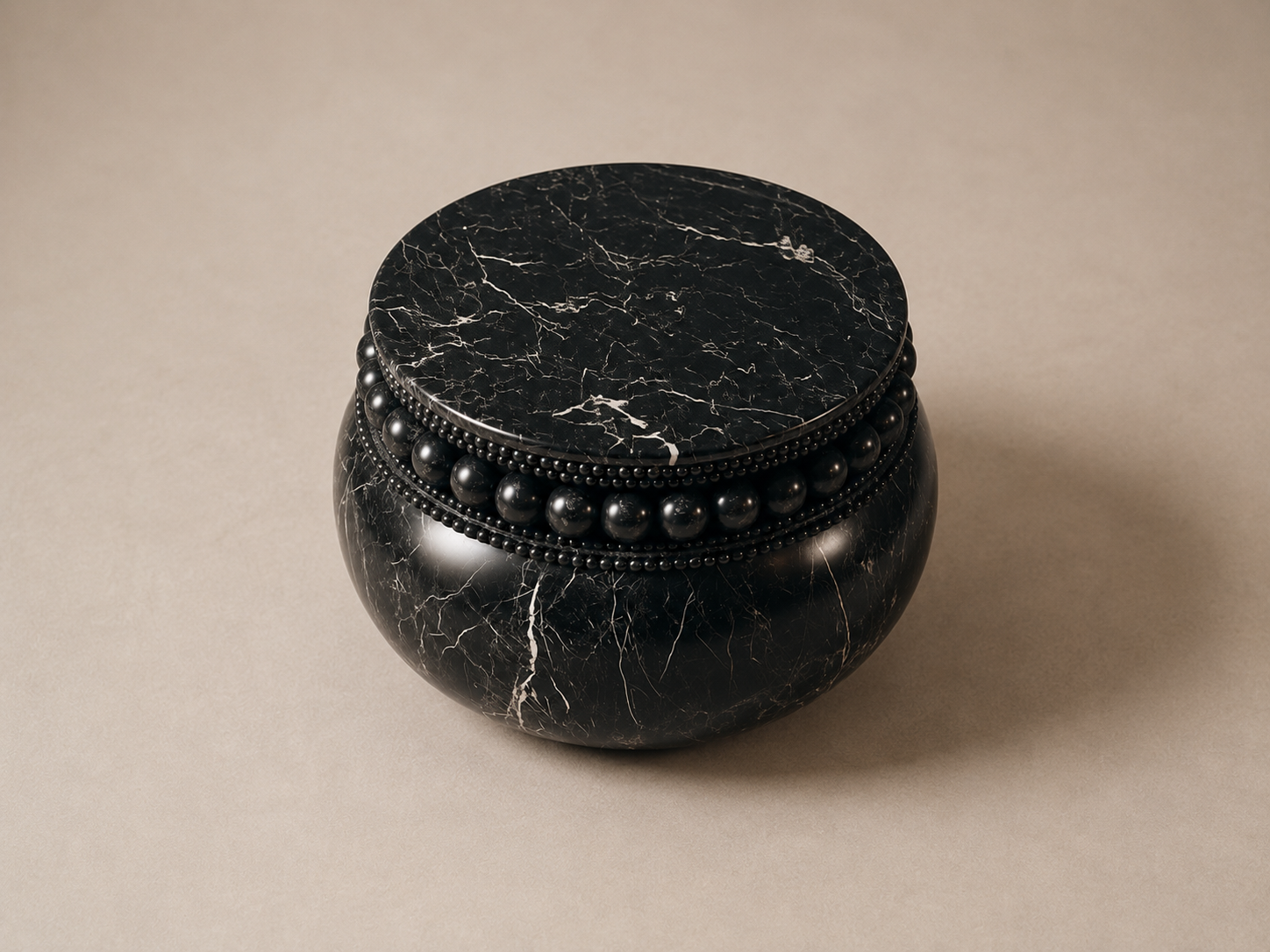 Beaded Pillow Base Compact black marble plinth base by 1-OPH, three-quarter studio view