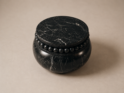 Beaded Pillow Base Compact black marble plinth base by 1-OPH, three-quarter studio view