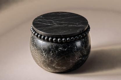 Beaded Pillow Base Globe black marble plinth base by 1-OPH, three-quarter studio view