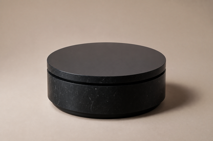 Circular Shadow-Gap Base Low black marble plinth base by 1-OPH, three-quarter studio view
