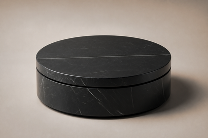 Circular Shadow-Gap Base Disc black marble plinth base by 1-OPH, three-quarter studio view