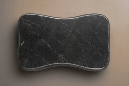 Convex Pillow Base Curved black marble plinth base by 1-OPH, overhead view