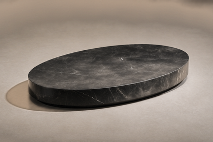 Oval Plinth Base Wide black marble plinth base by 1-OPH, three-quarter studio view