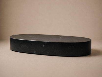 Oval Plinth Base Low black marble plinth base by 1-OPH, three-quarter studio view