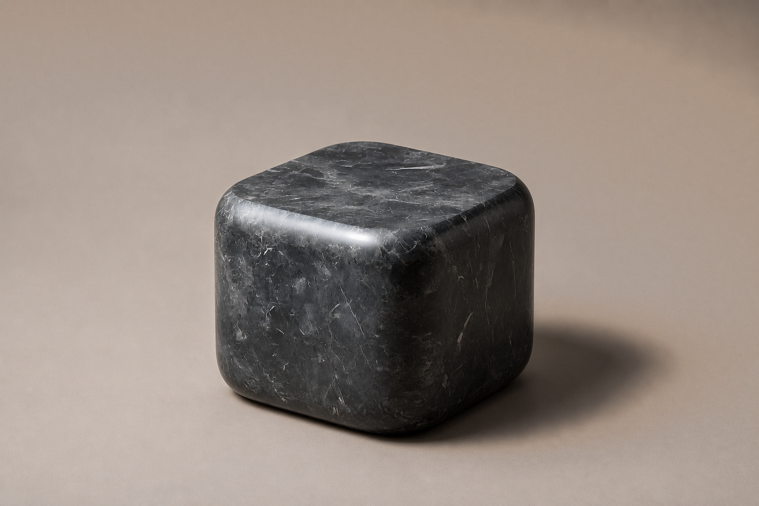 Rounded Cube Base Cube black marble plinth base by 1-OPH, three-quarter studio view