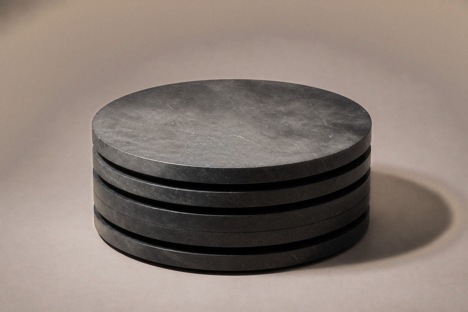 Stacked Disc Base Wide black marble plinth base by 1-OPH, three-quarter studio view