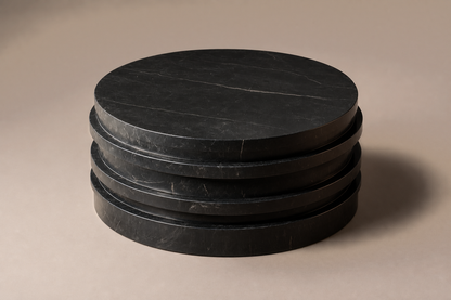 Stacked Disc Base Tall black marble plinth base by 1-OPH, three-quarter studio view