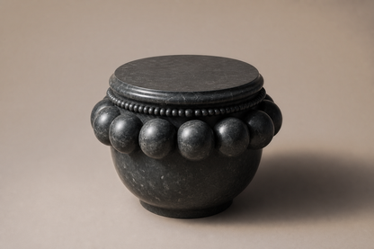 Beaded Pillow Plinth Nero black marble plinth base by 1-OPH, three-quarter studio view